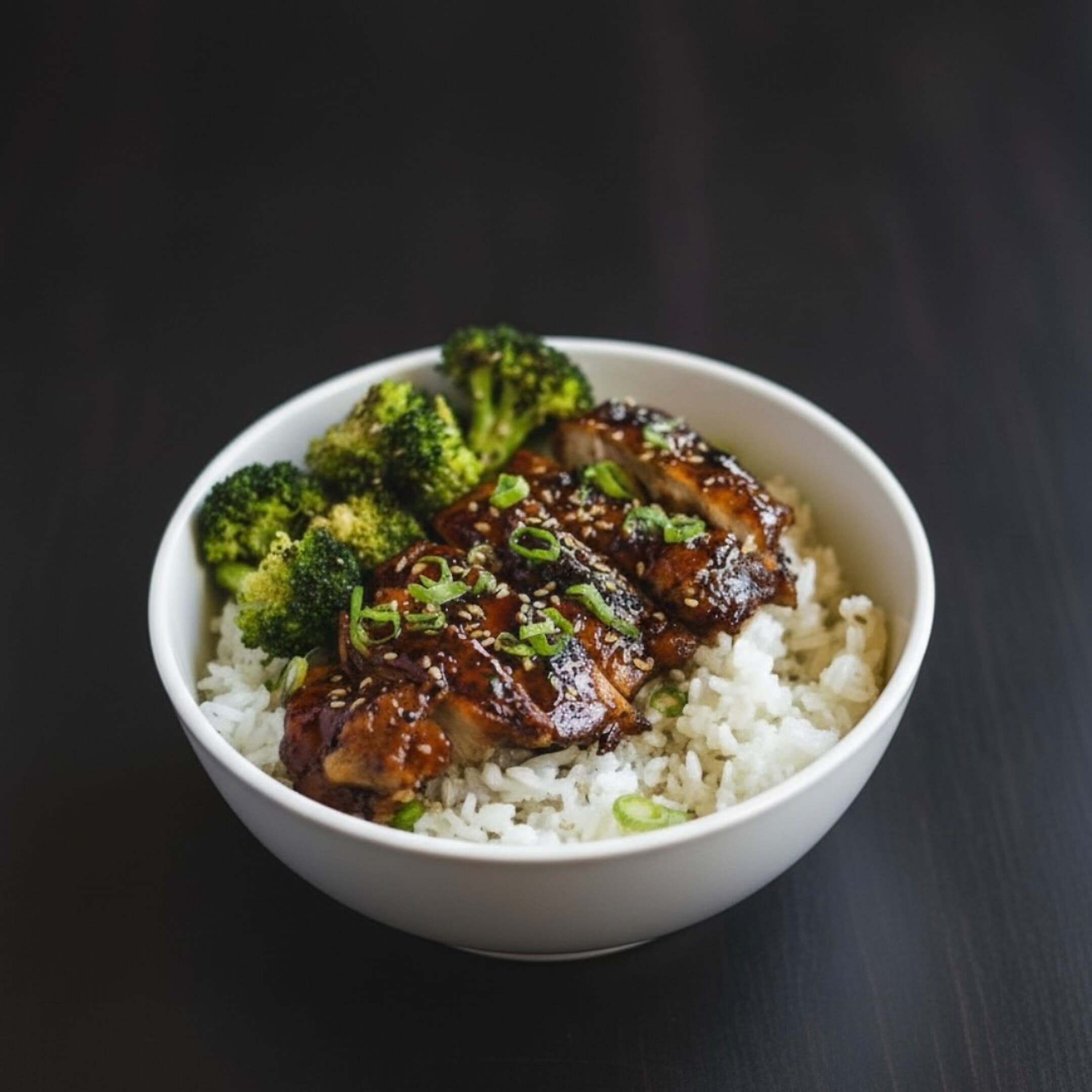 Teriyaki chicken rice bowl, plated dark
